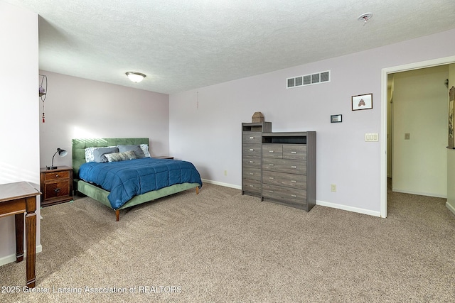 carpeted bedroom with a textured ceiling