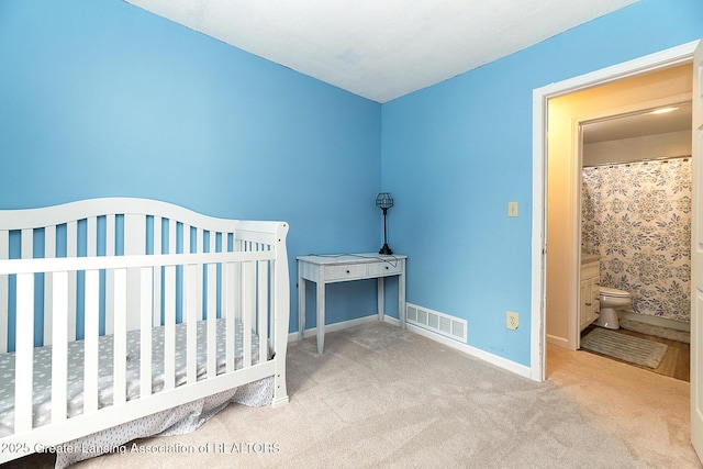 bedroom with light colored carpet