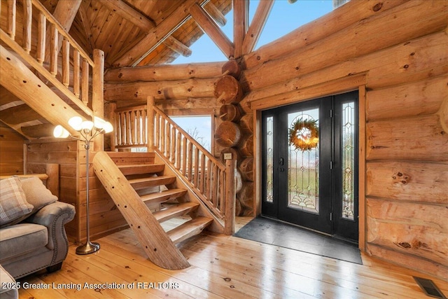 foyer with beam ceiling, hardwood / wood-style floors, wood ceiling, and high vaulted ceiling