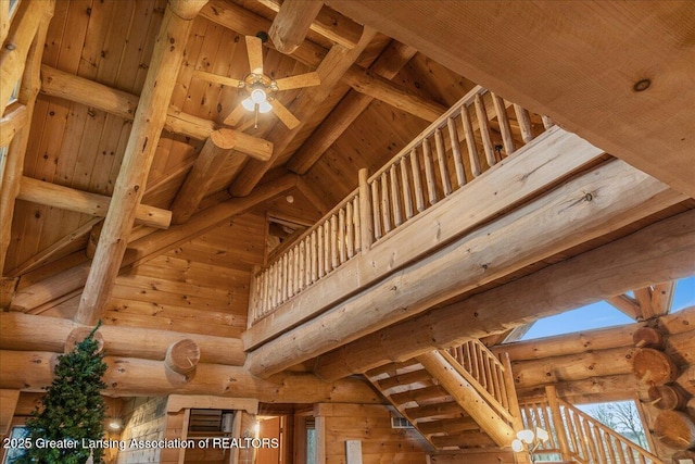 room details with beamed ceiling, ceiling fan, and wooden ceiling