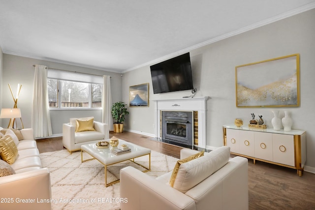 living room with wood-type flooring and ornamental molding