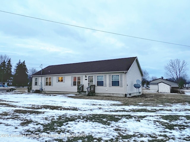 view of front facade featuring a shed