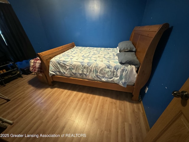 bedroom featuring hardwood / wood-style floors