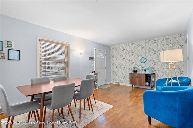 dining room with wood-type flooring