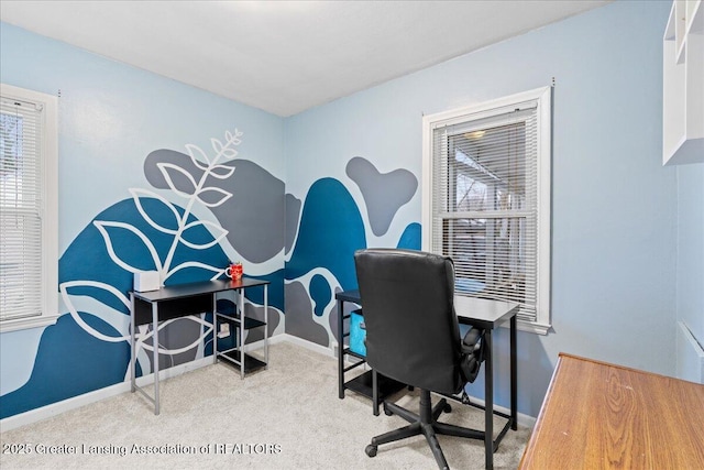 carpeted home office featuring plenty of natural light