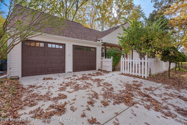 garage featuring fence