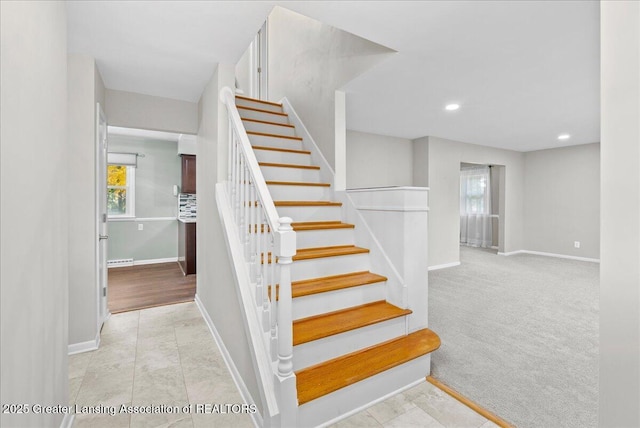 stairs with carpet flooring, recessed lighting, baseboards, and a wealth of natural light