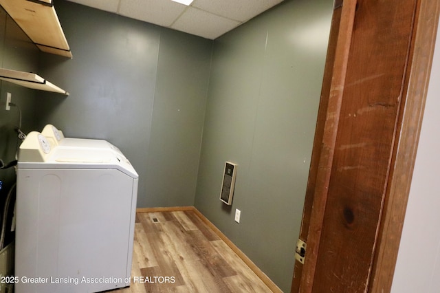 clothes washing area with separate washer and dryer and light hardwood / wood-style floors