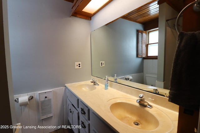 bathroom with vanity, wood ceiling, and toilet