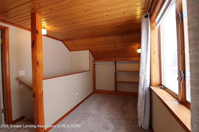 additional living space with lofted ceiling, carpet flooring, and wood ceiling