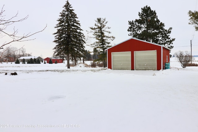 view of snow covered garage