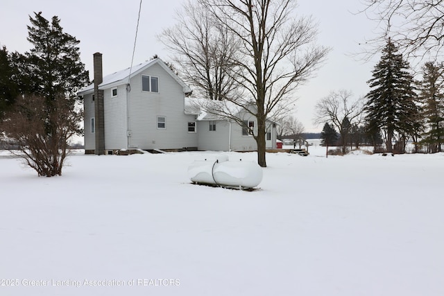 view of yard layered in snow