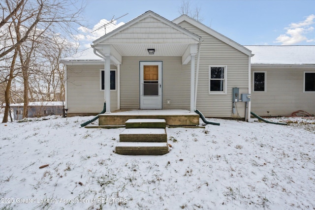 view of snow covered house