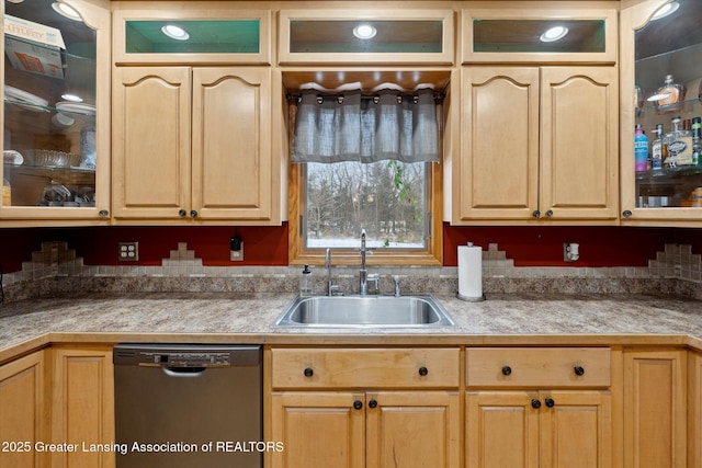 kitchen with black dishwasher, sink, and light brown cabinets