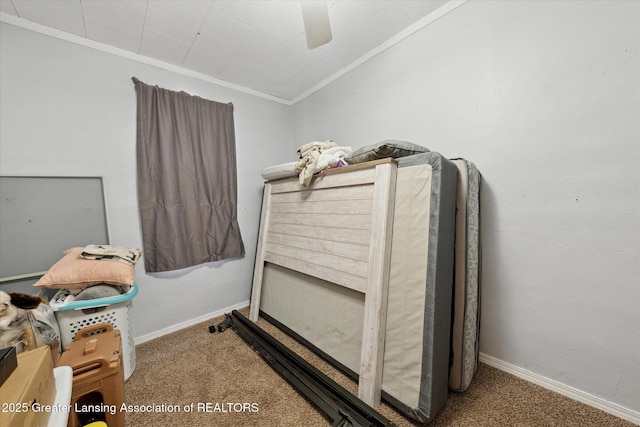 bedroom featuring crown molding, carpet floors, and ceiling fan