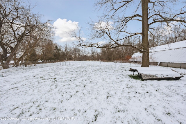 view of yard covered in snow