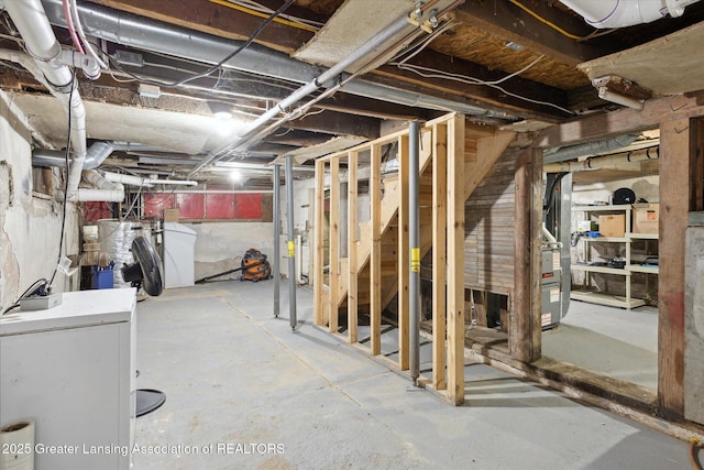 basement featuring washer / dryer and water heater