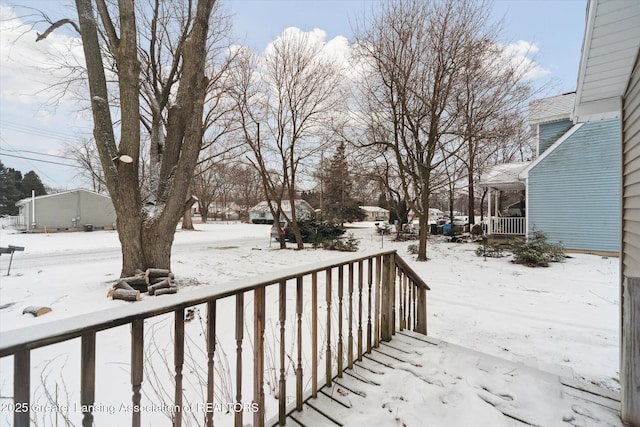 view of snow covered deck