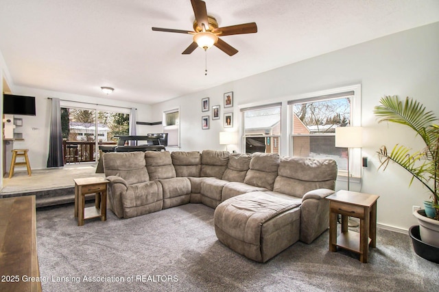 living room featuring carpet floors and ceiling fan