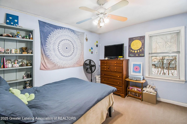 bedroom featuring light colored carpet and ceiling fan