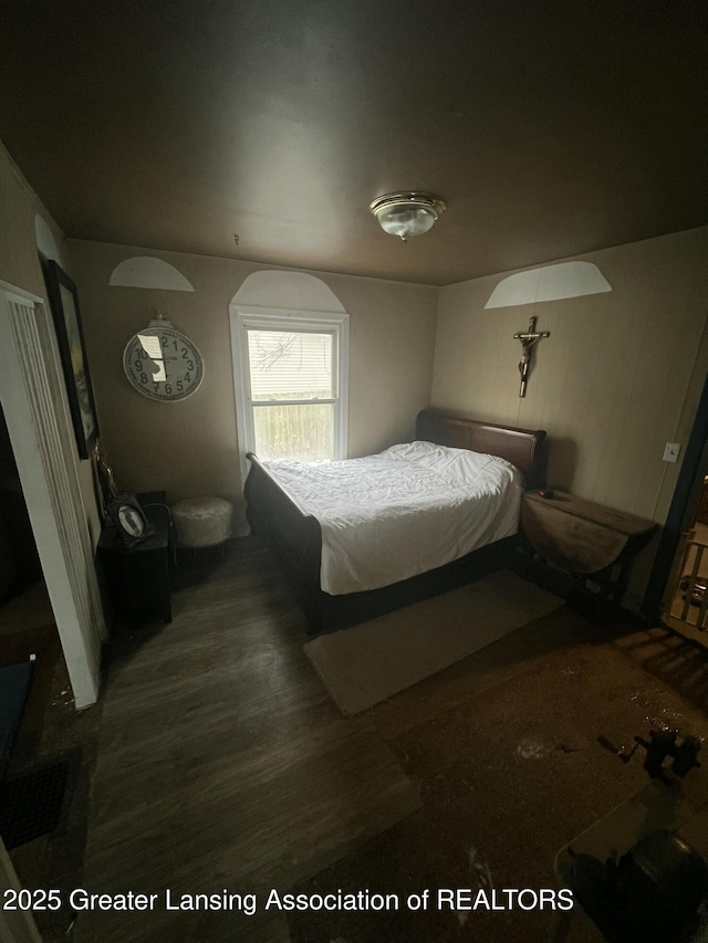 bedroom featuring dark hardwood / wood-style floors