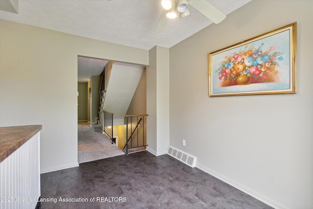 unfurnished room featuring ceiling fan