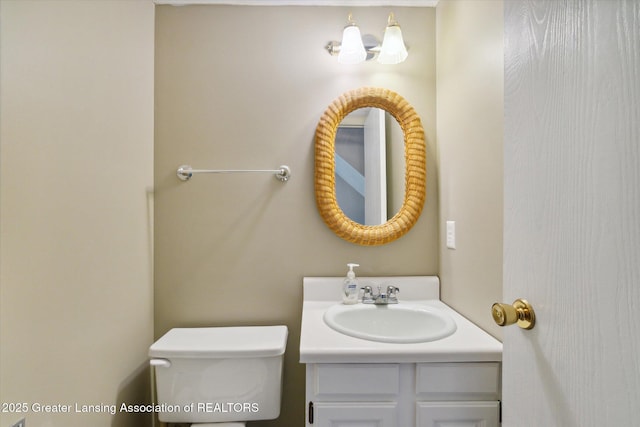 bathroom featuring vanity and toilet