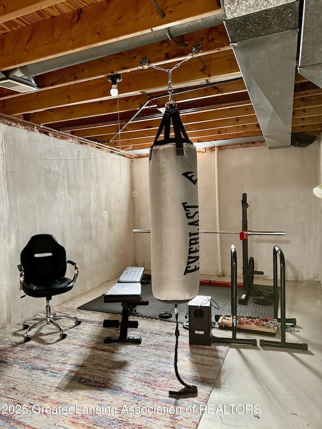 exercise area with hardwood / wood-style flooring