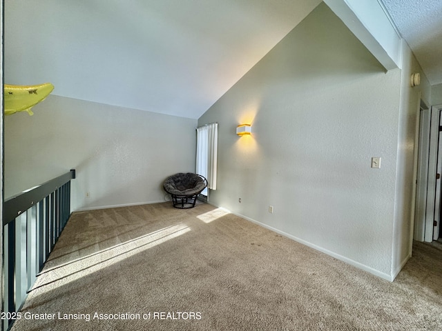 bonus room featuring vaulted ceiling and carpet floors