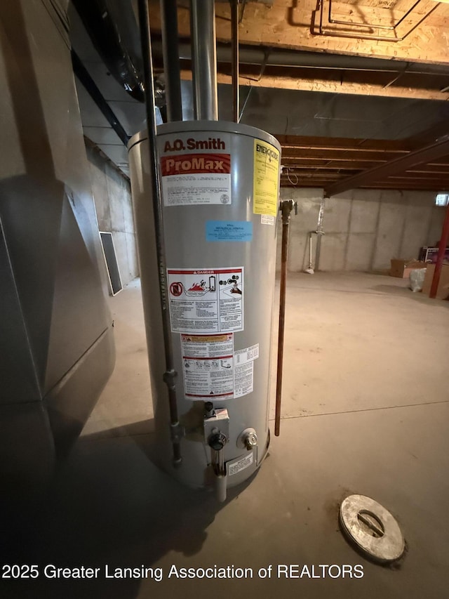 utility room featuring water heater