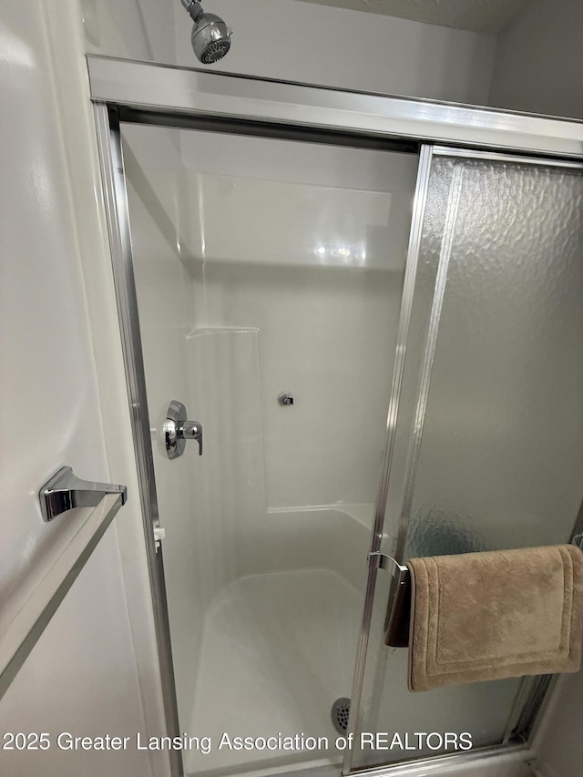 bathroom featuring an enclosed shower