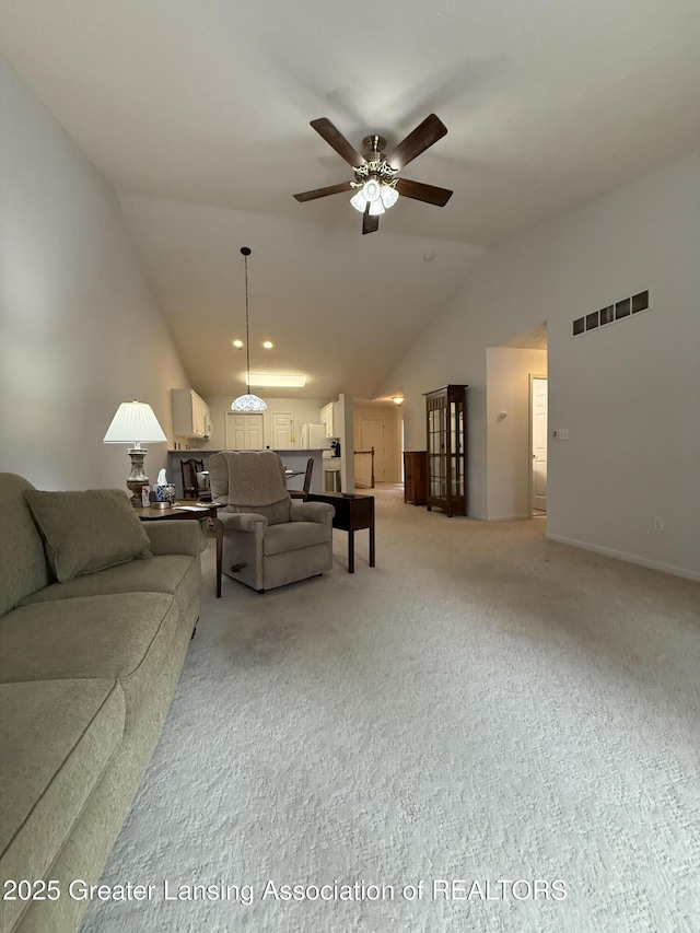 living room featuring light carpet, high vaulted ceiling, and ceiling fan