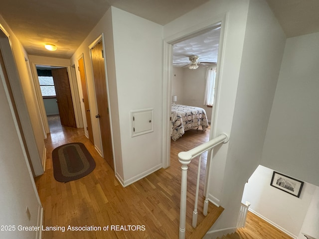 hall with light hardwood / wood-style floors