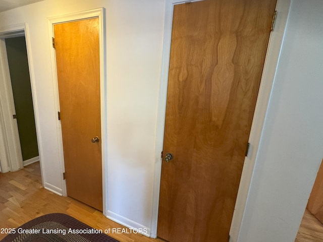 hall with light hardwood / wood-style floors