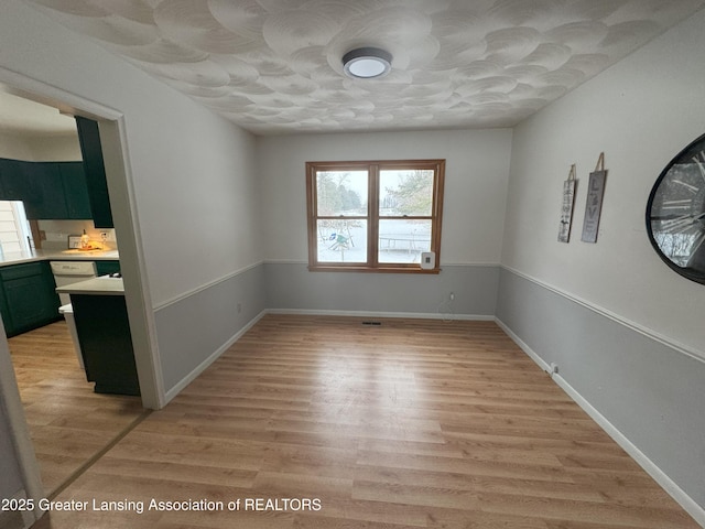 empty room with light wood-type flooring