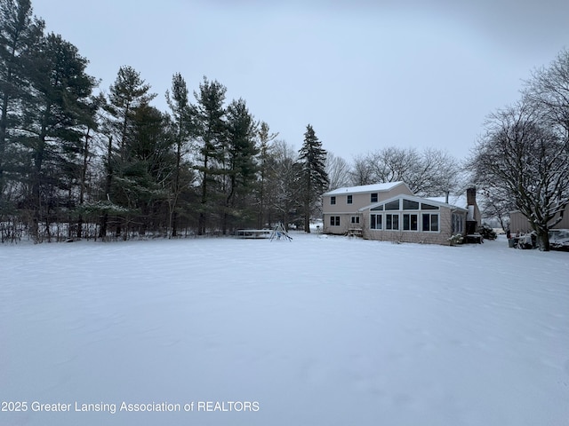 view of yard layered in snow