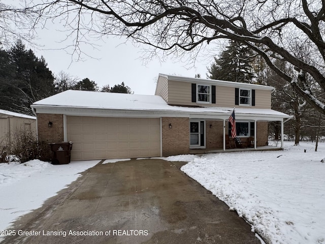 front of property with a garage and covered porch