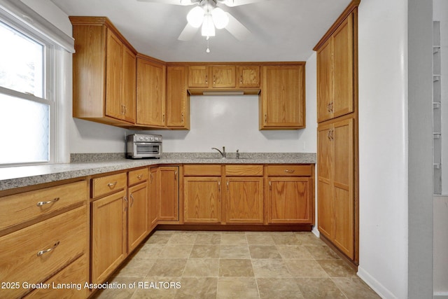 kitchen with sink and ceiling fan