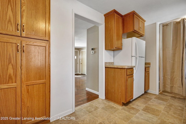 kitchen featuring white fridge