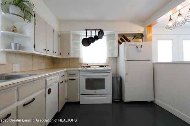 kitchen with white cabinetry, white appliances, plenty of natural light, and pendant lighting