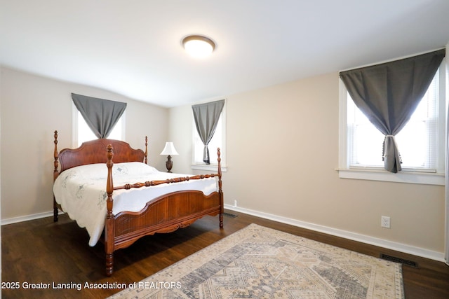 bedroom featuring dark hardwood / wood-style floors