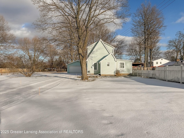 view of home's exterior with an outbuilding and a garage