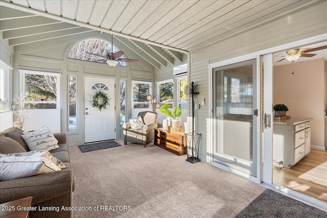 sunroom with wood ceiling, ceiling fan, and vaulted ceiling