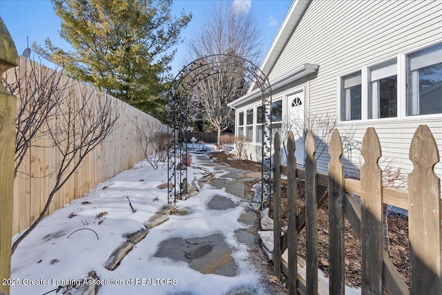 view of yard layered in snow