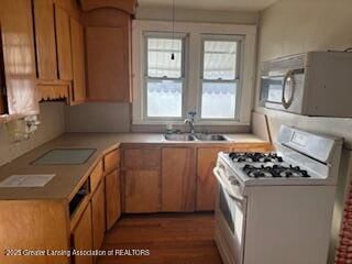 kitchen featuring sink and white gas range oven