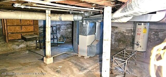 basement with water heater and heating unit