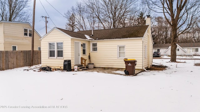 view of snow covered house