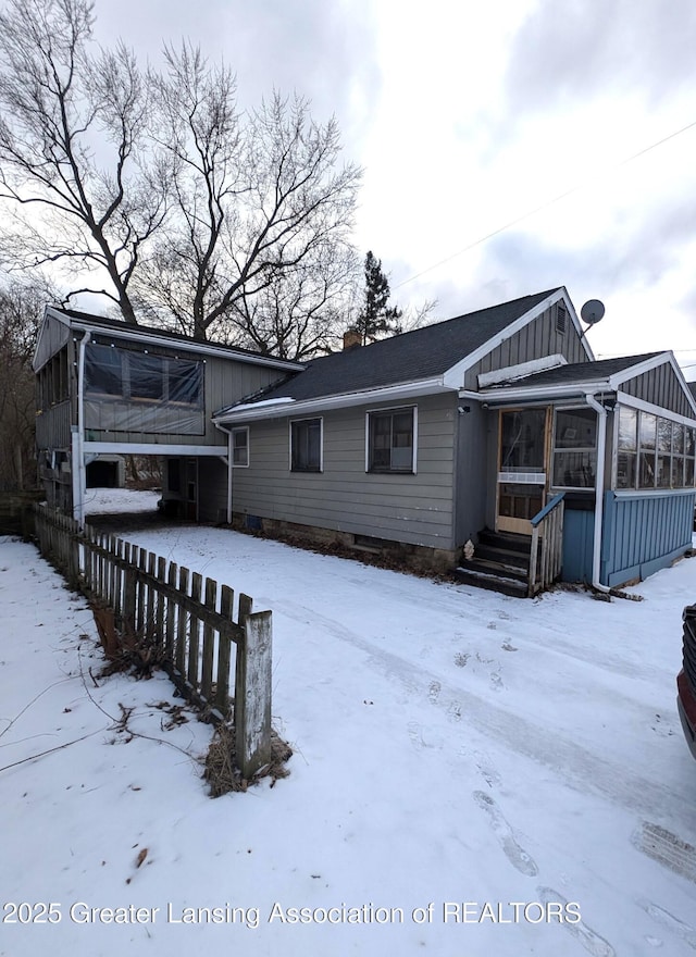 view of front of property with a sunroom