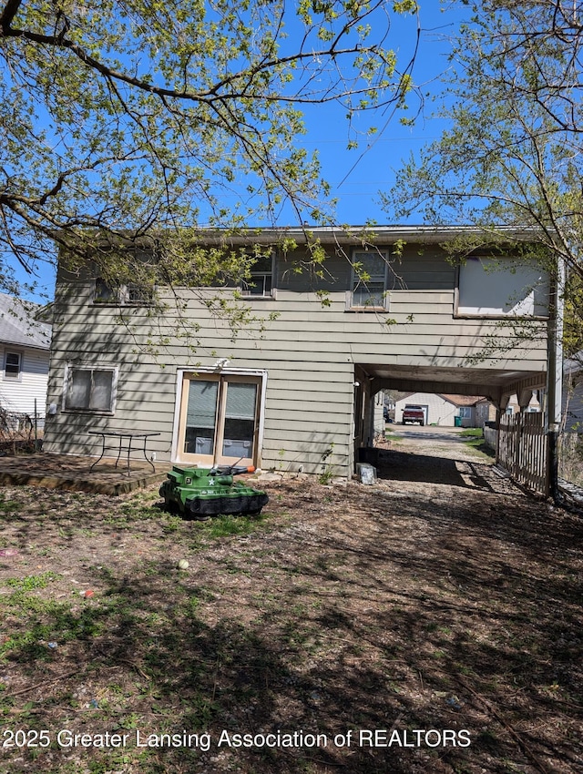 411 Filley St, Lansing, MI 48906 - back of property featuring a carport