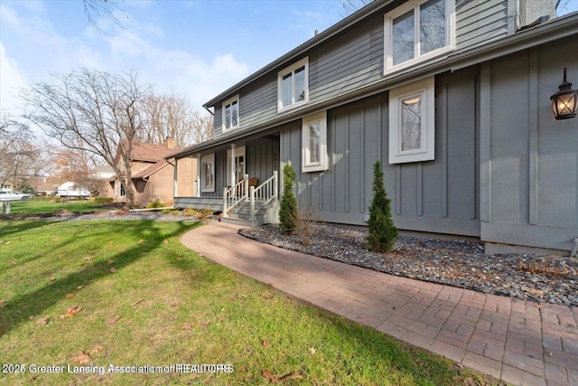 view of property exterior with a yard